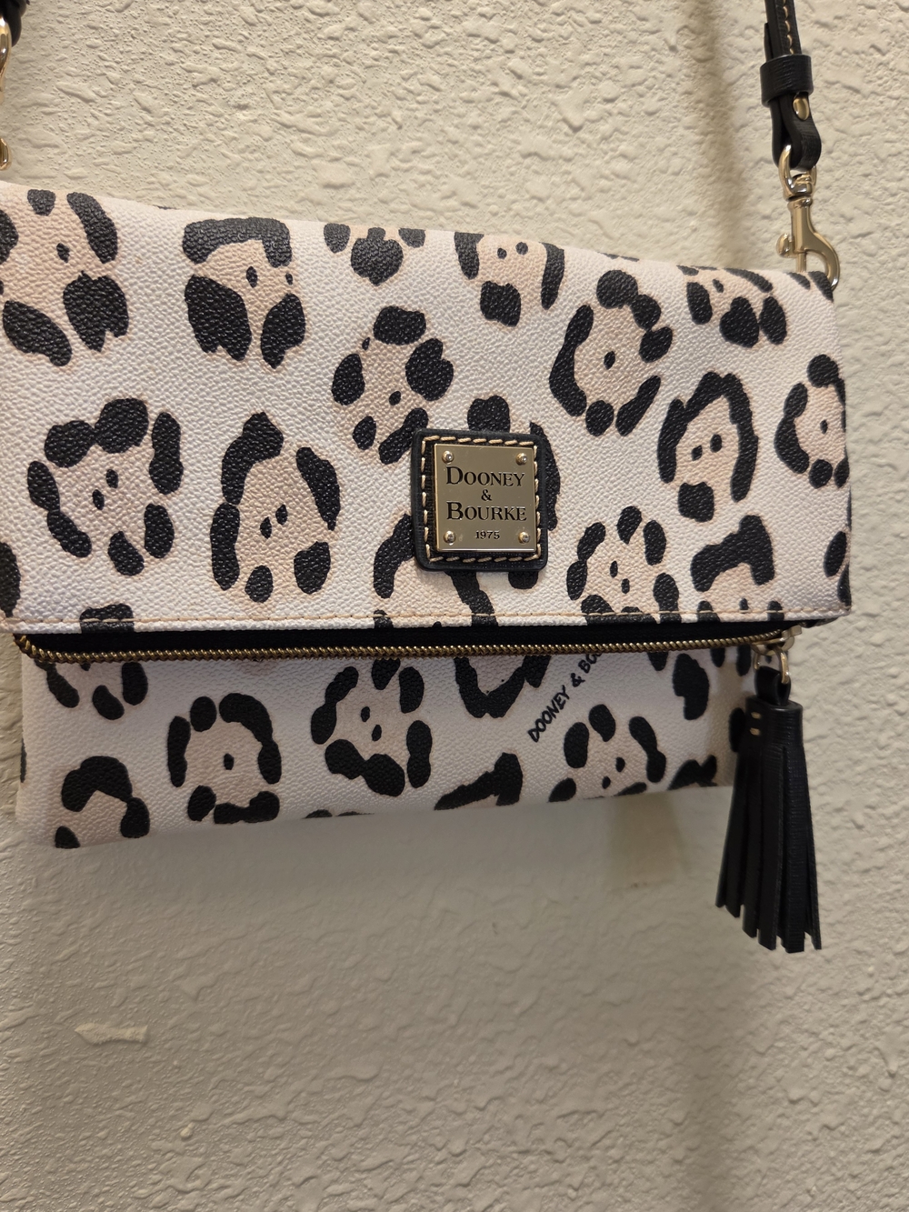 Dooney & Bourke Cream And Black Leopard Foldover Crossbody with Tassel
